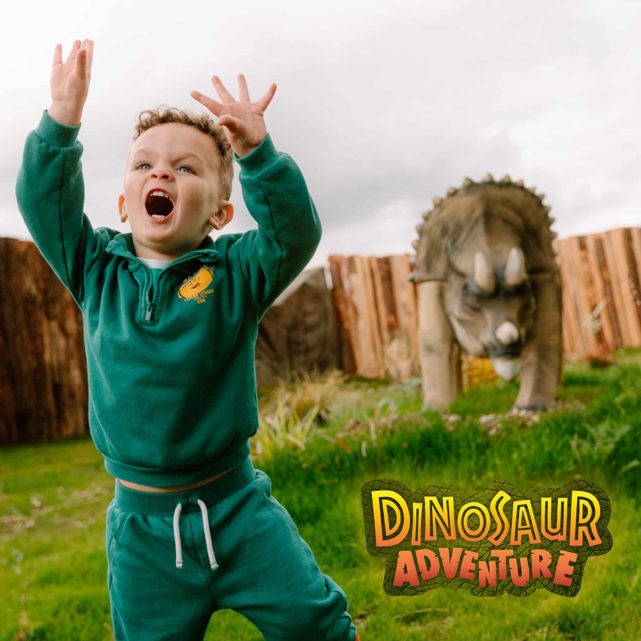 Small boy roaring like a dinosaur